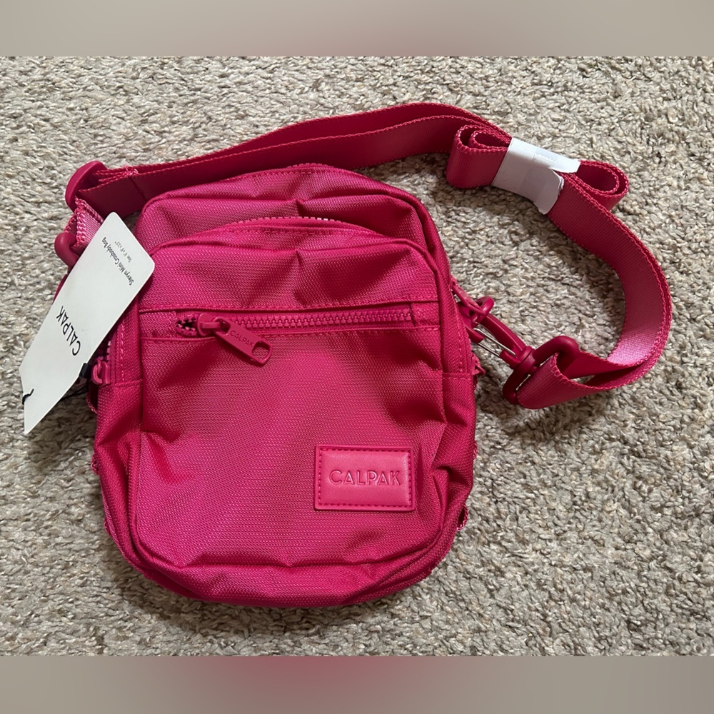 NWT CALPAK Stevyn Mini Crossbody Bag  Dragonfruit Pink Adjustable Travel Zip Up